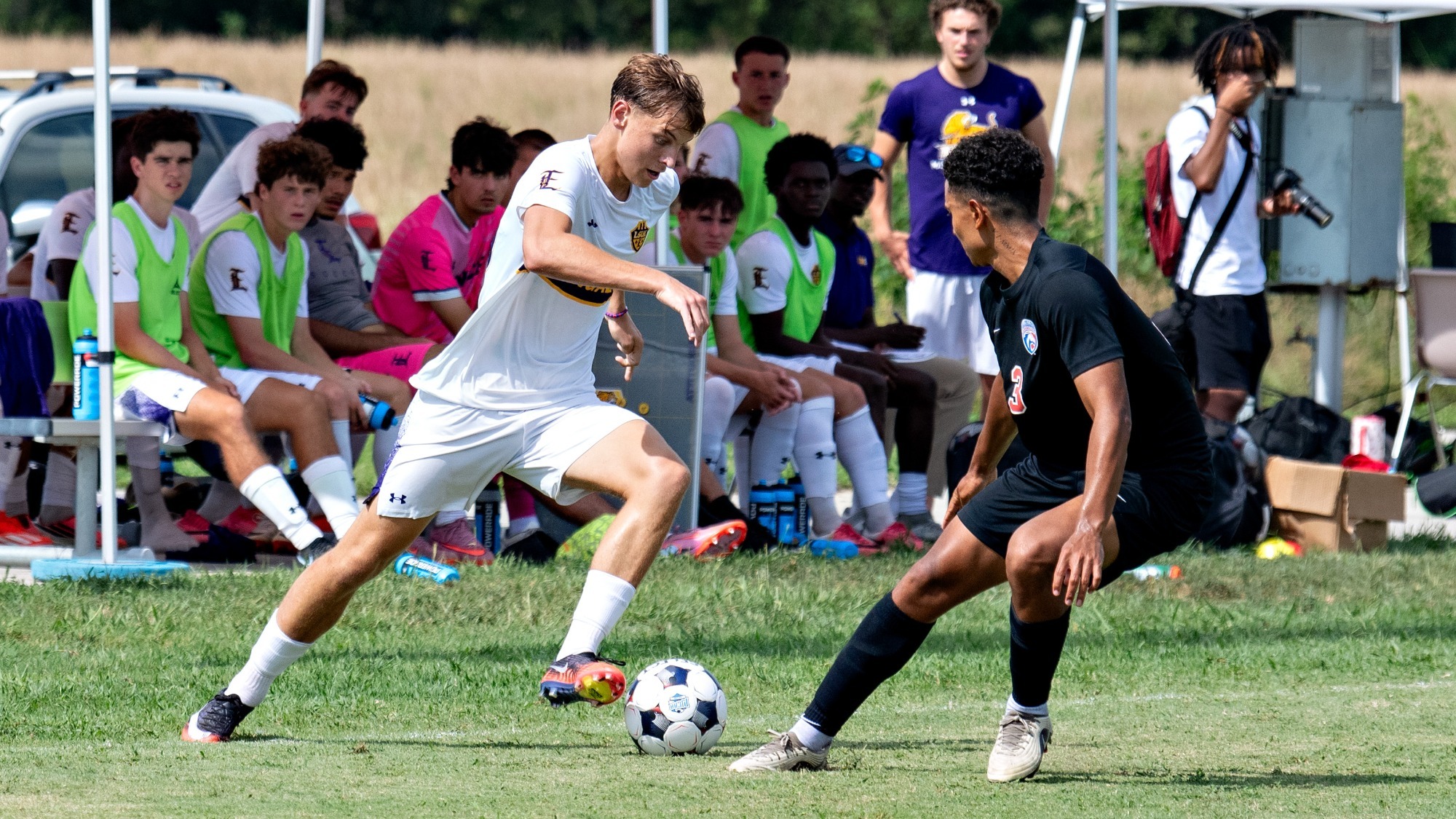 Oliver Farrell takes on a defender in a LSUE Men's Soccer home game.
