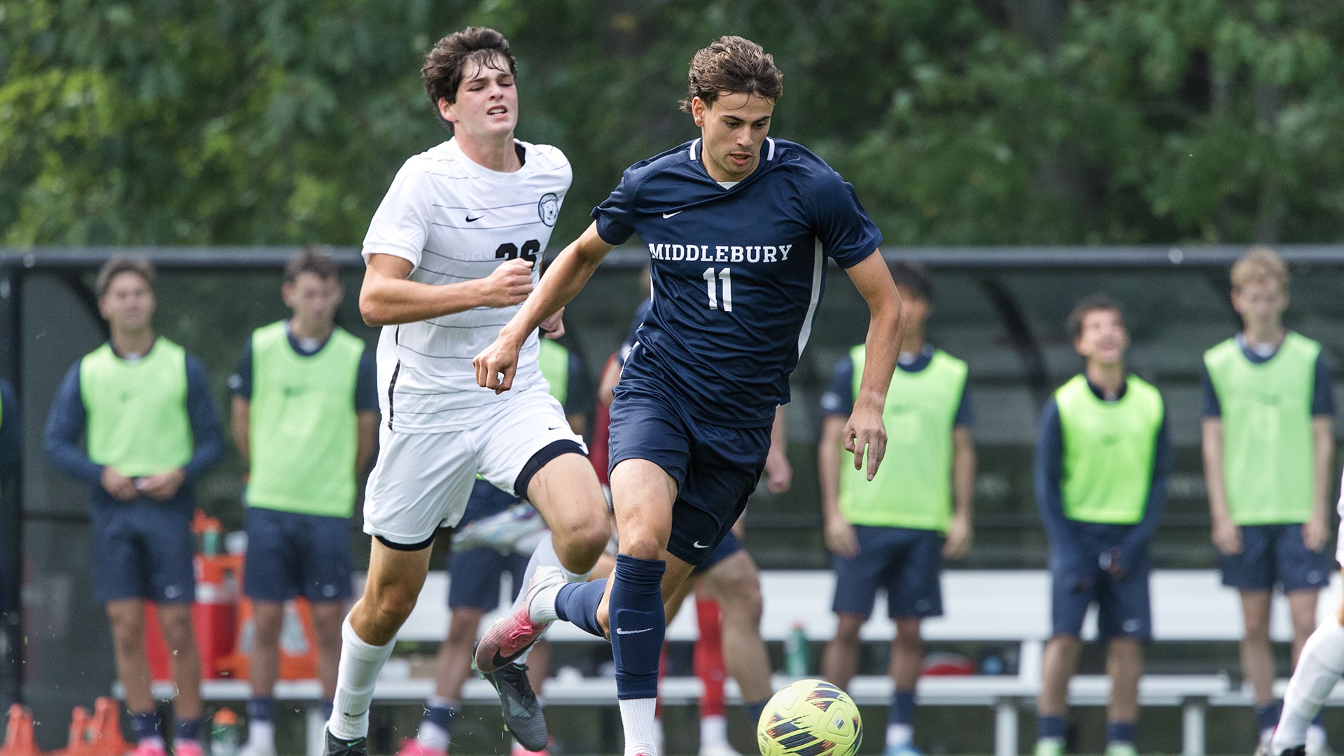 Will Sawin hustles down the field with possession against Bowdoin.