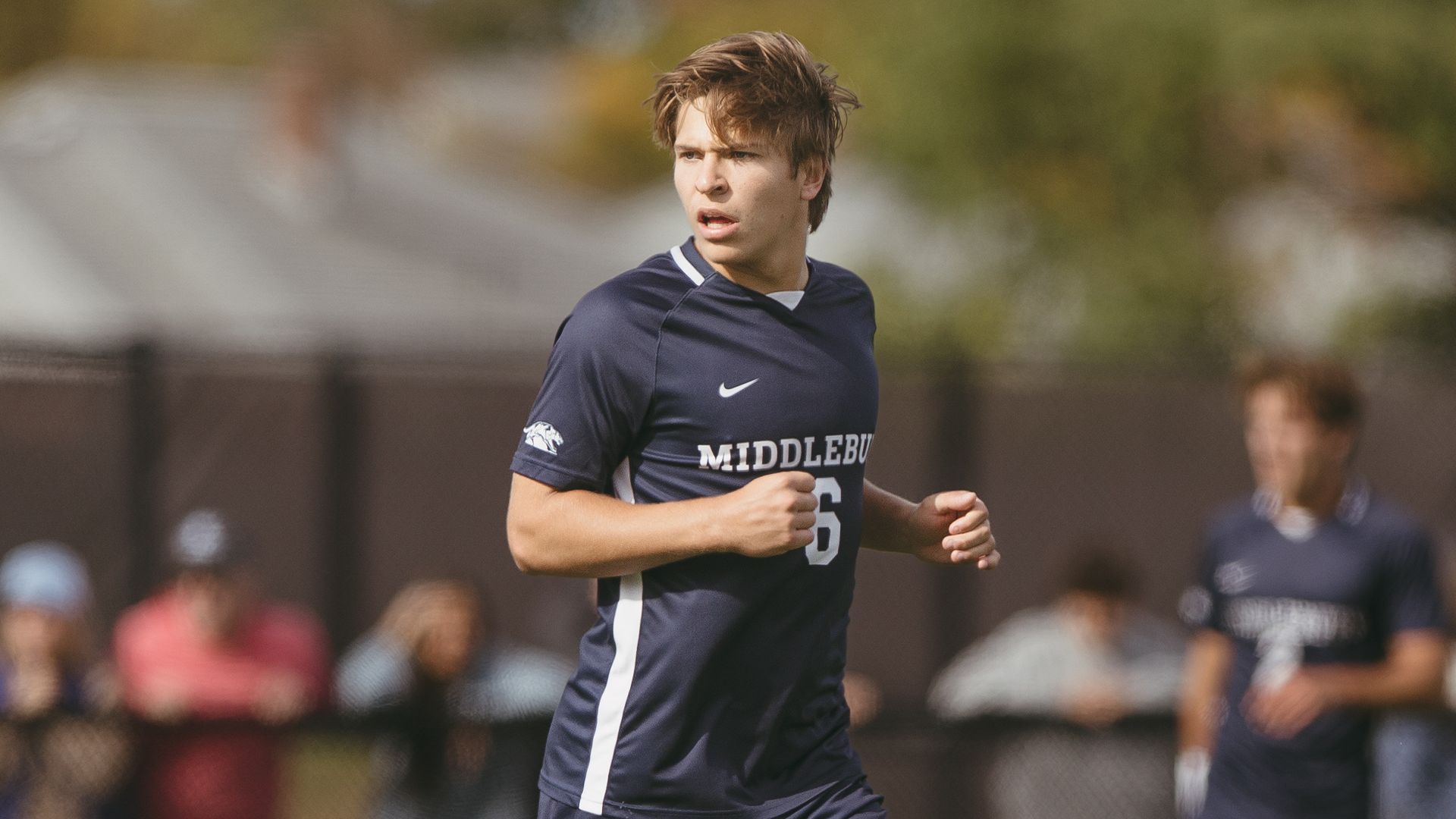 A close-up picture of Dylan Payne in action against Tufts.