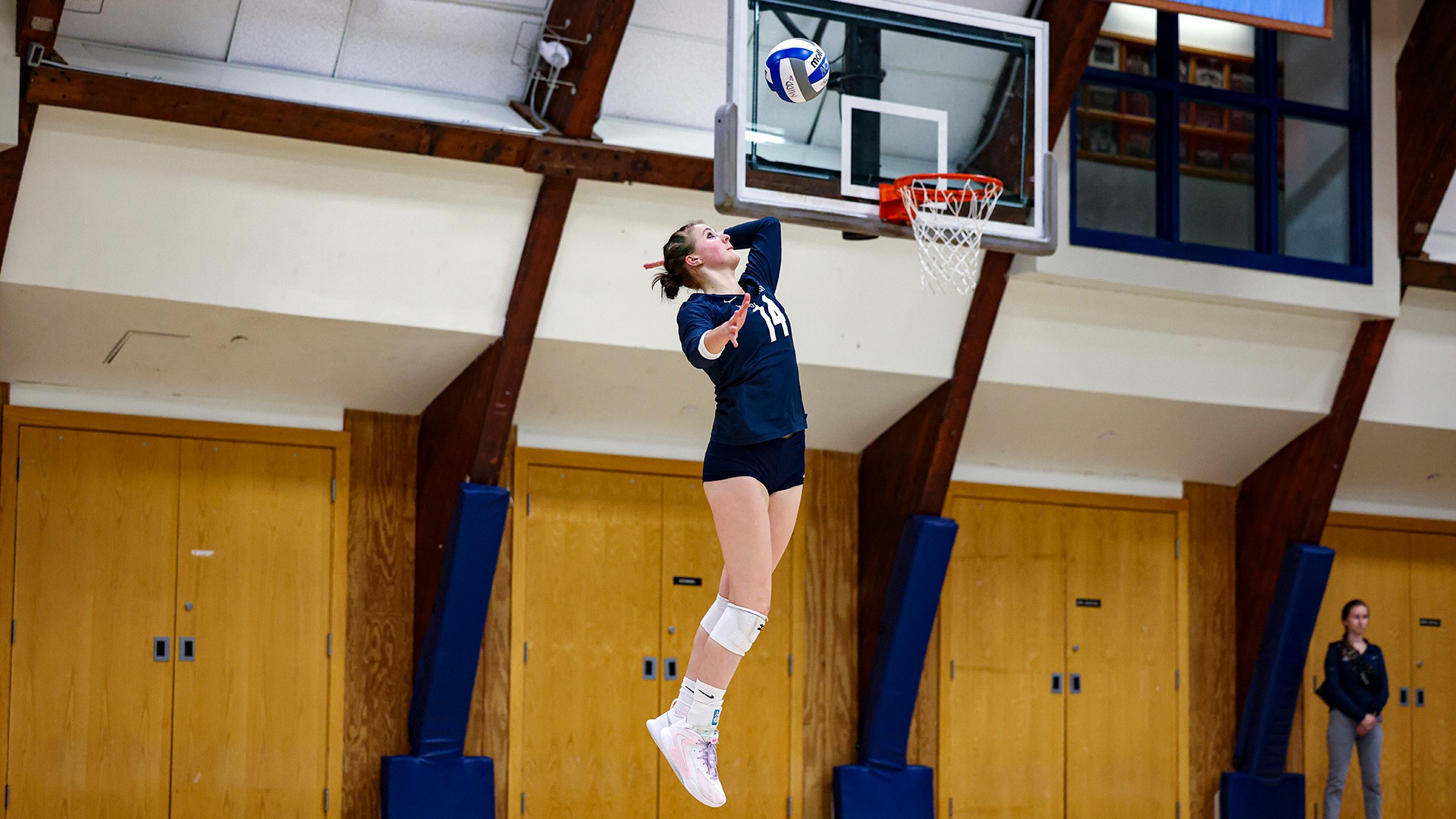 Natalie Stanford attempts a serve during a match against Tufts earlier this season.