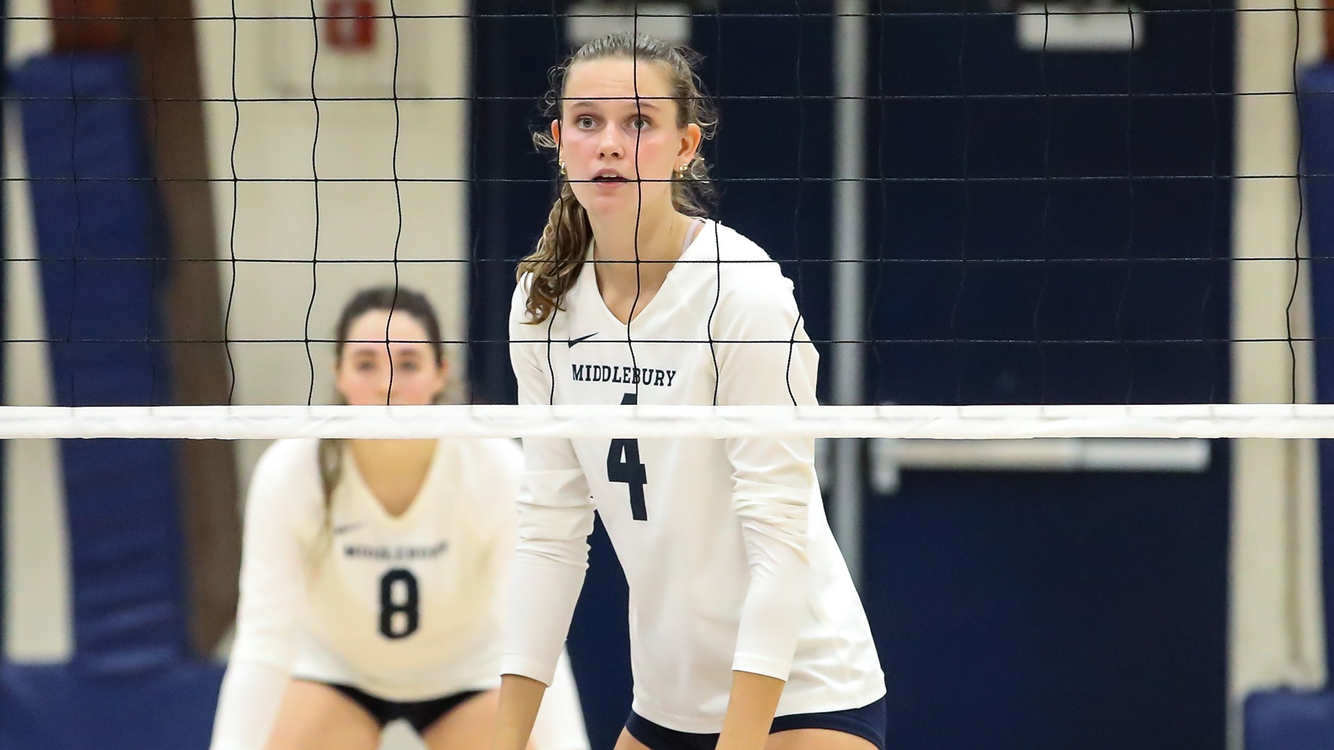 Eliza Lowe readies for a serve during a match against Bates.