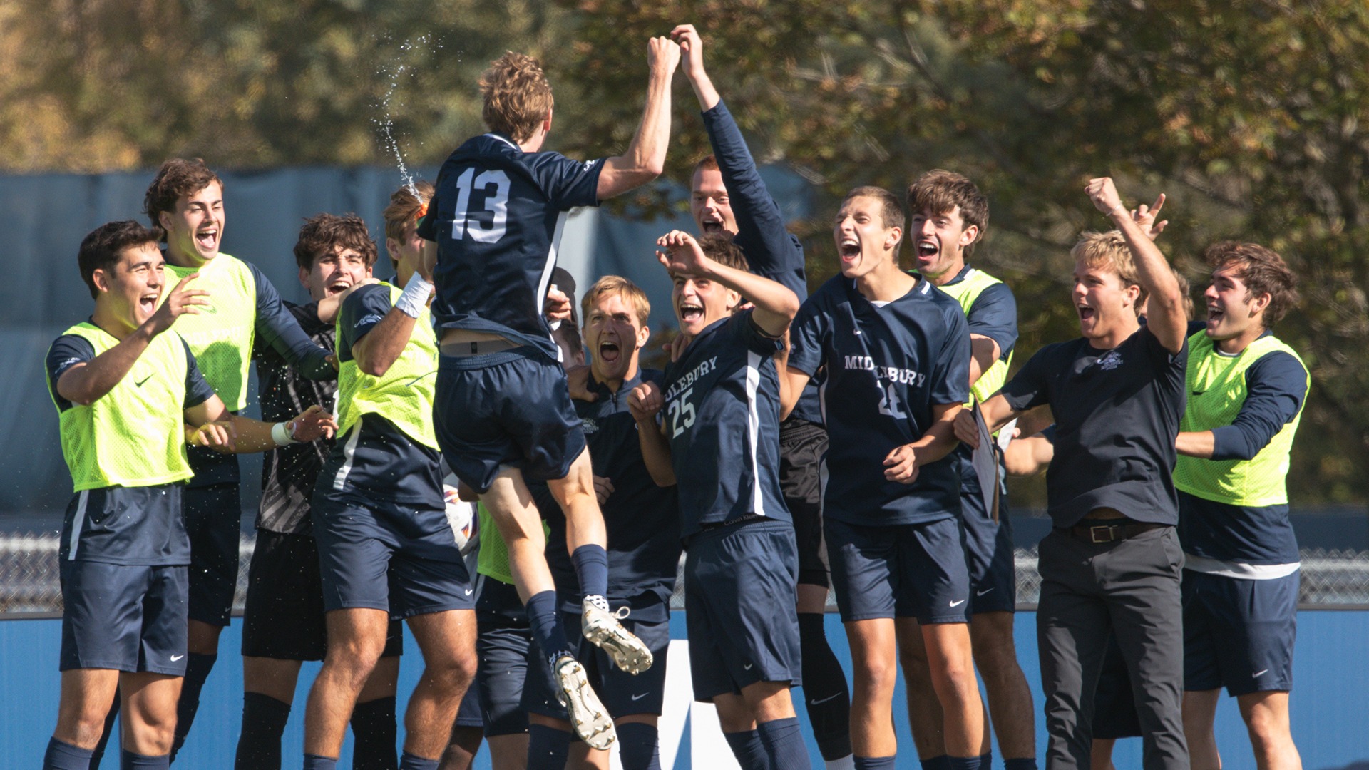 The Middlebury men's soccer team celebrates a goal against Maine Maritime Academy earlier this season.