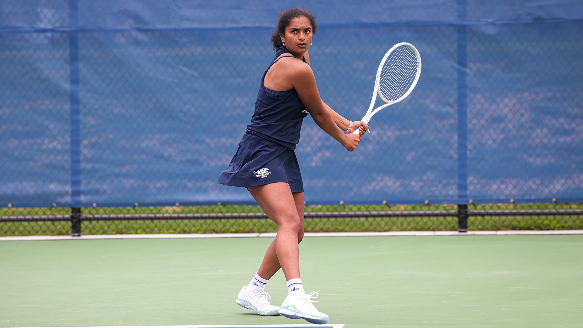 Ananya Annapantula attempts to return a shot during a match for Middlebury in 2025.