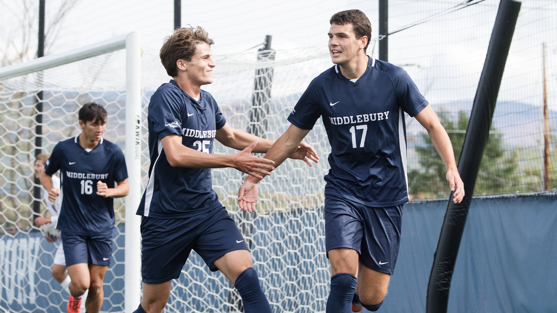 Hugo Horwitz and Samuel Leroyer celebrate a goal against Maine Maritime.