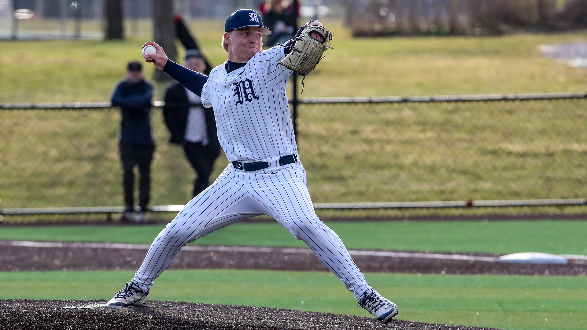 Christian Zebrowski winding up to deliver a pitch against Amherst.