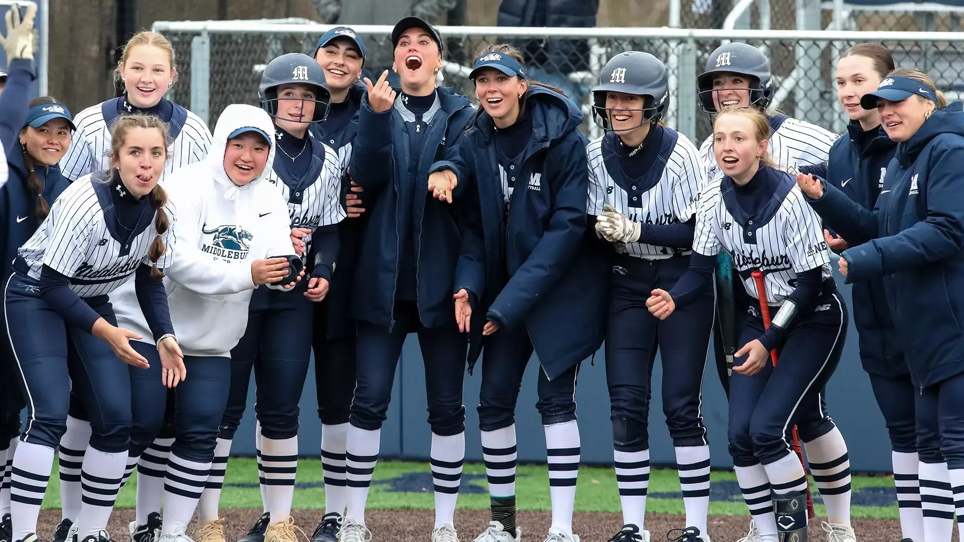 The Middlebury softball team celebrates a home run earlier this season against Keene State.