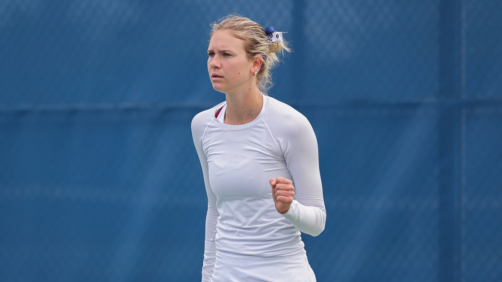 Elsie Van Wieren of the Middlebury women's tennis team pumps her fist during the team's match against Williams in the NESCAC Quarterfinals.