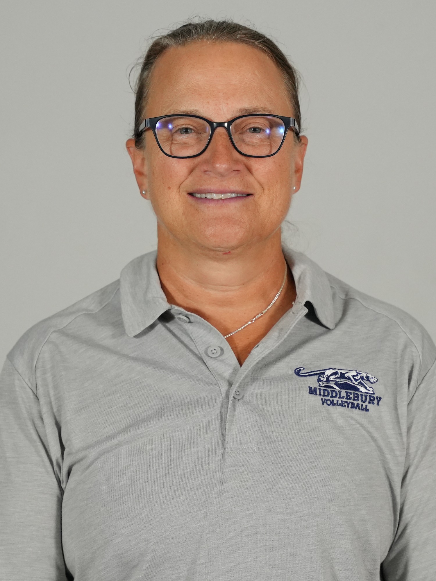 A headshot photo of Middlebury volleyball coach Sarah Raunecker