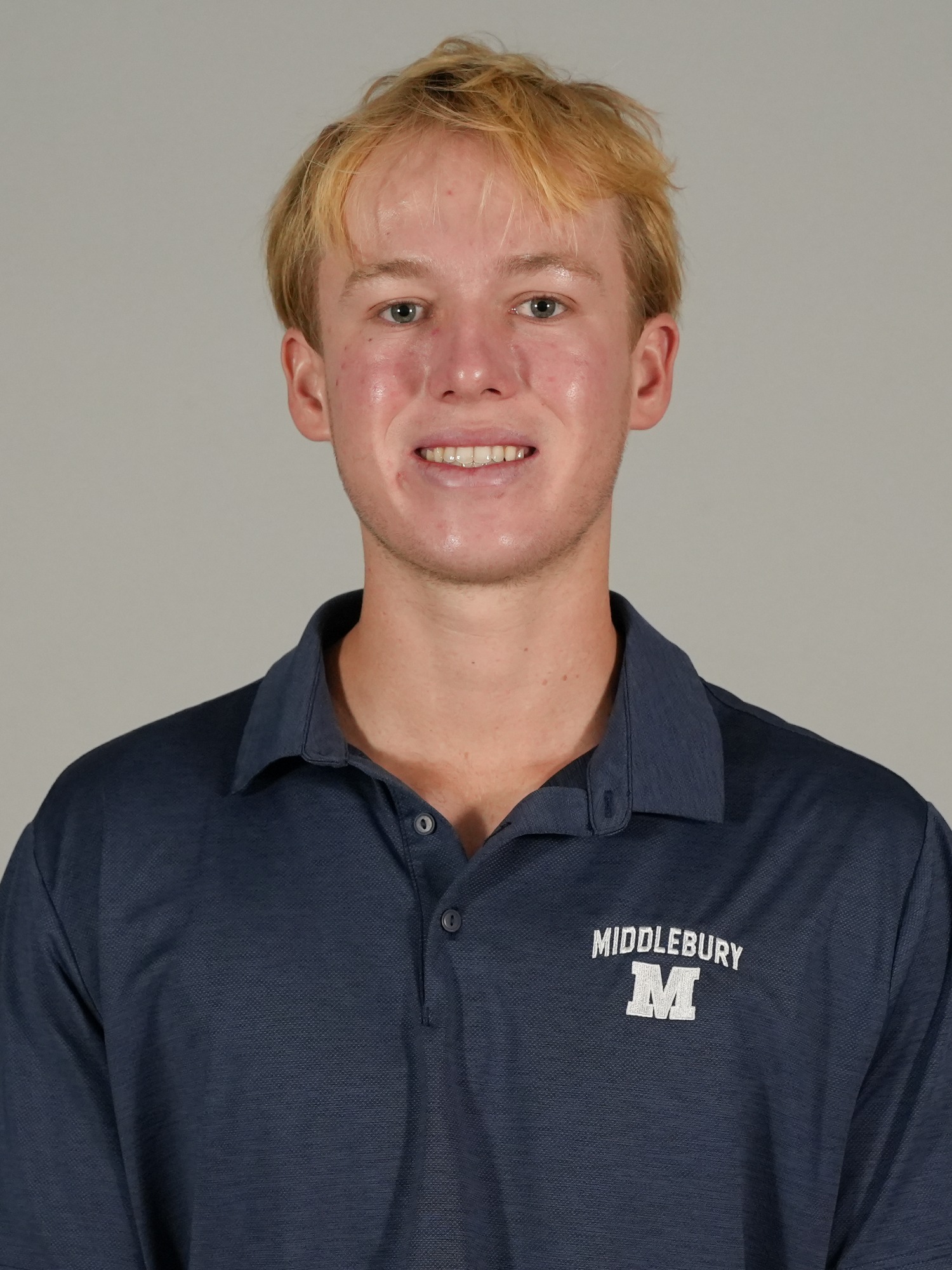 A headshot photo of Middlebury volleyball coach Spencer Ralph