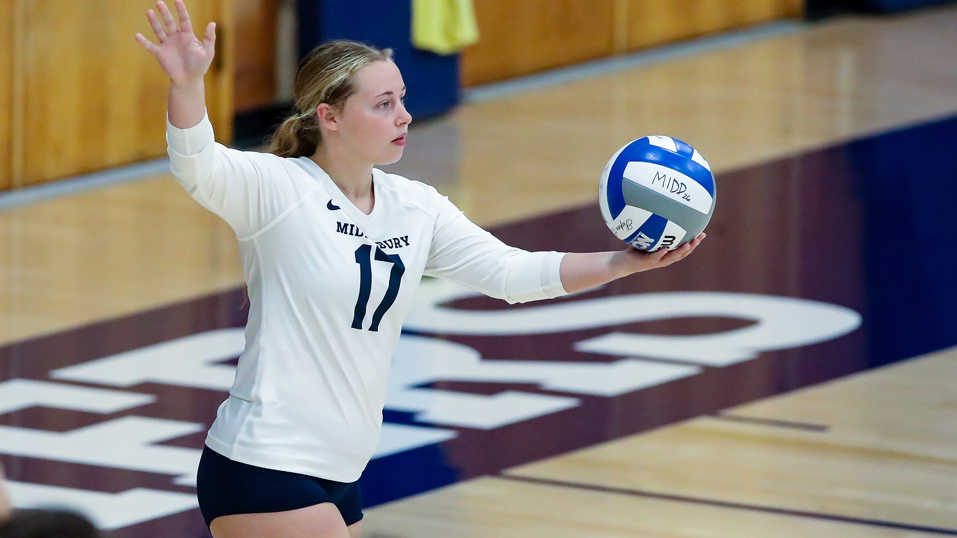 Nora Harapat readies to serve during Middlebury's 3-0 win over Castleton on Wednesday evening.