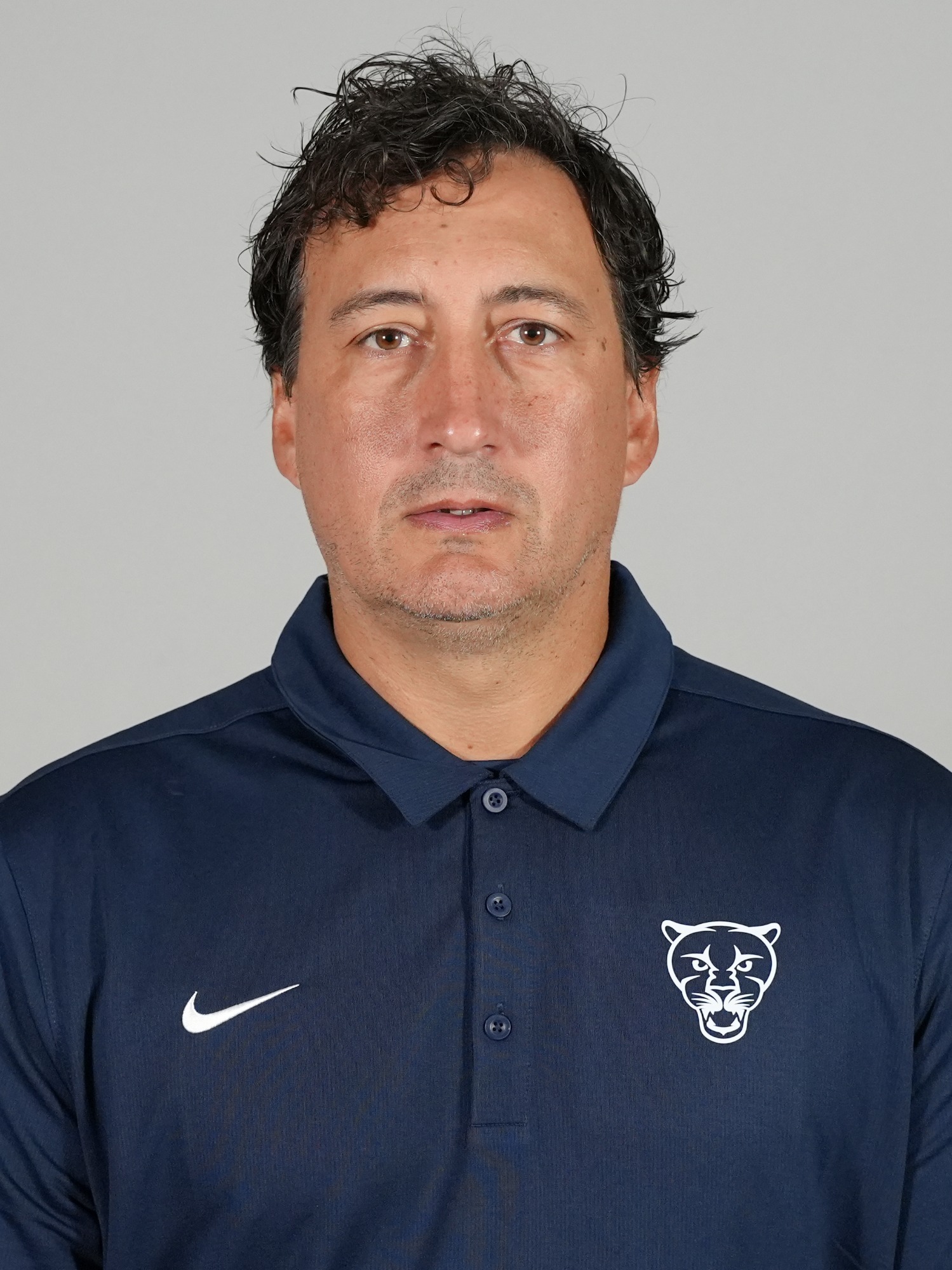 A headshot of Middlebury football coach Patrick Madden.