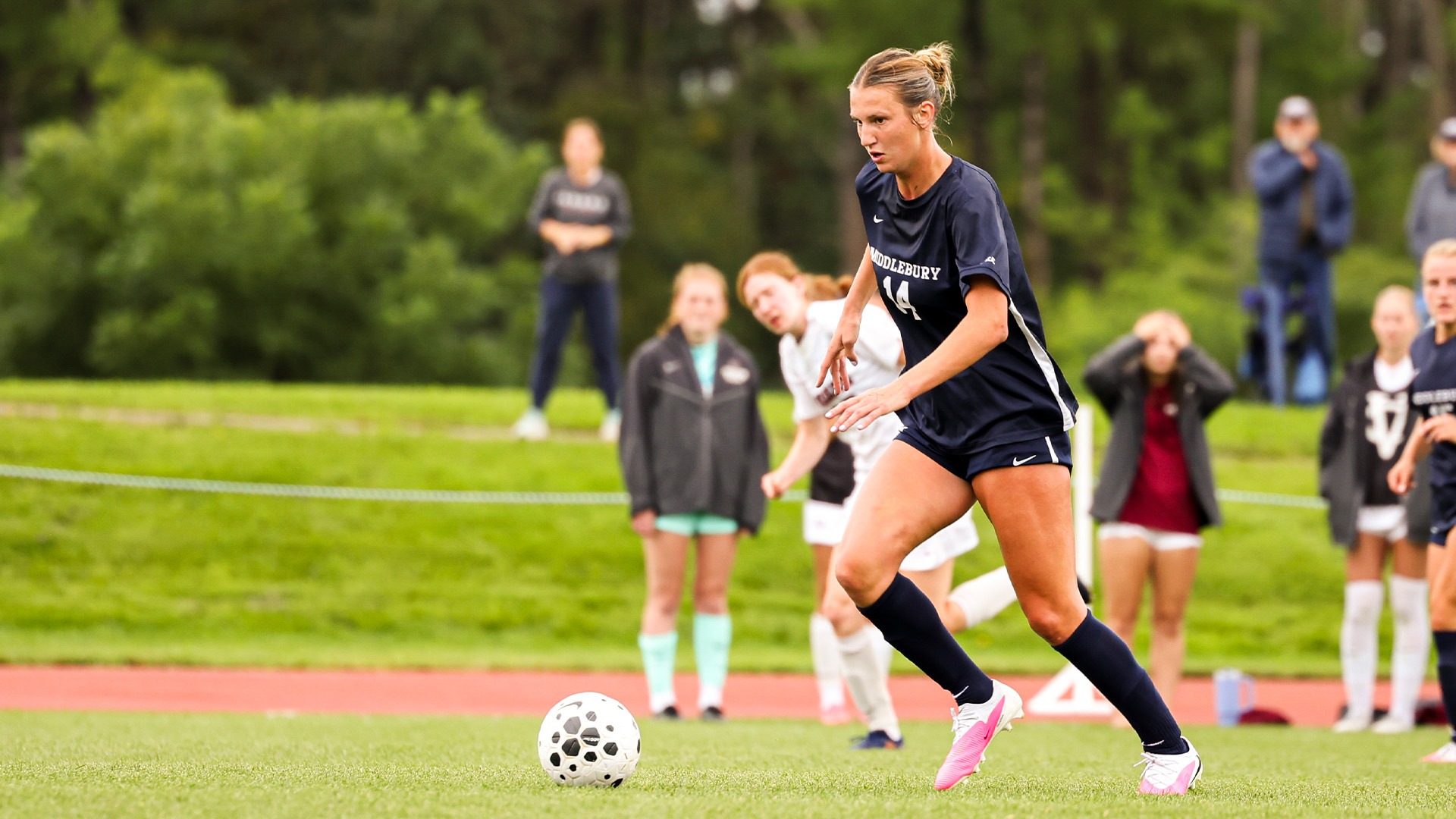 Noelle Mallory keeps her eyes upfield during the team's match against Vassar.