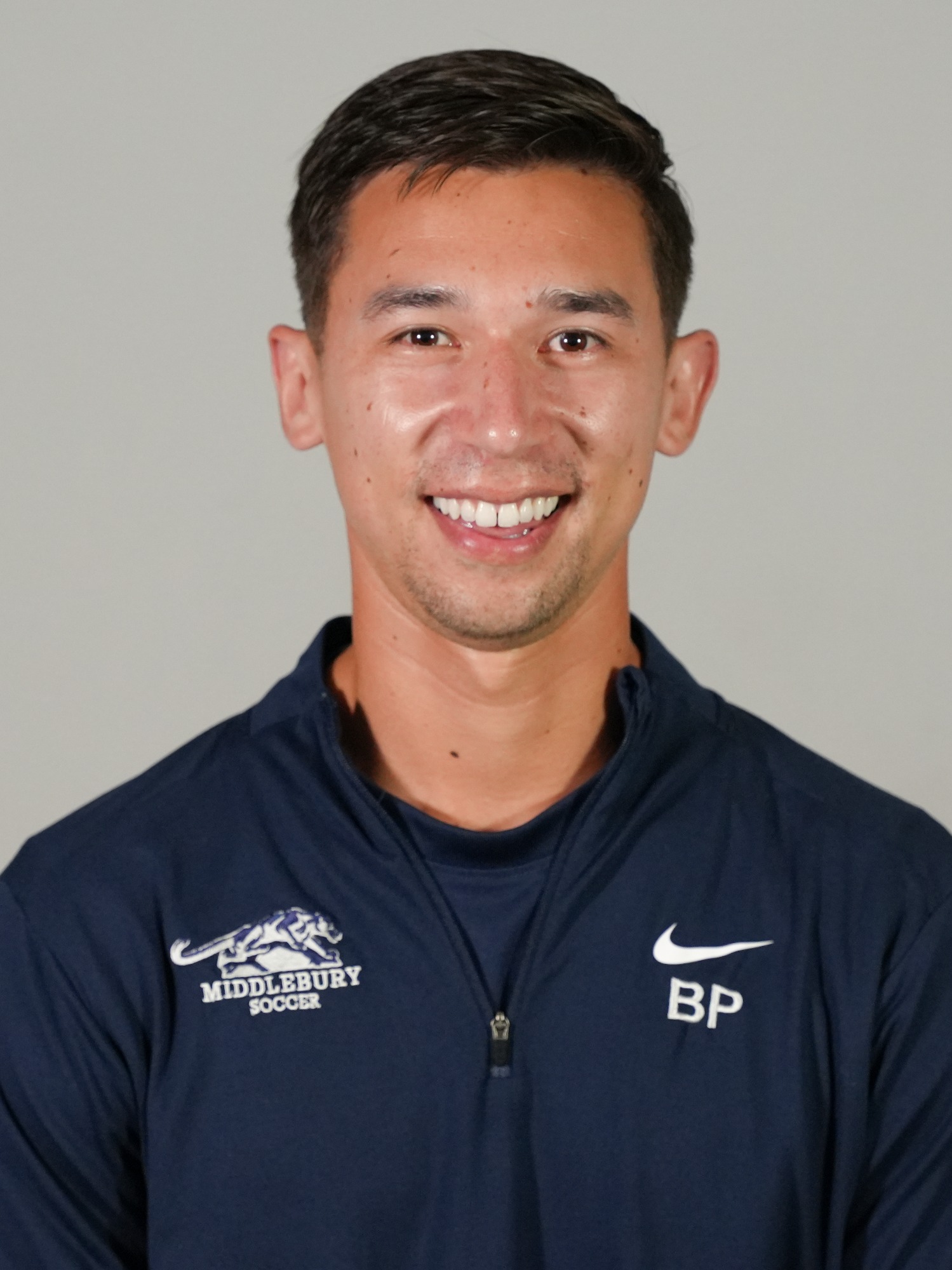 A headshot of Middlebury men's soccer coach Ben Potter.
