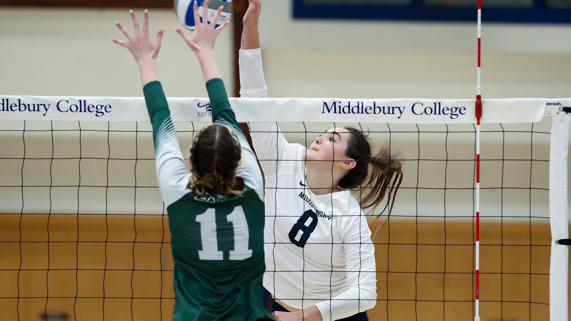 Molly Harrison attempts a kill during Middlebury volleyball's match against Castleton.