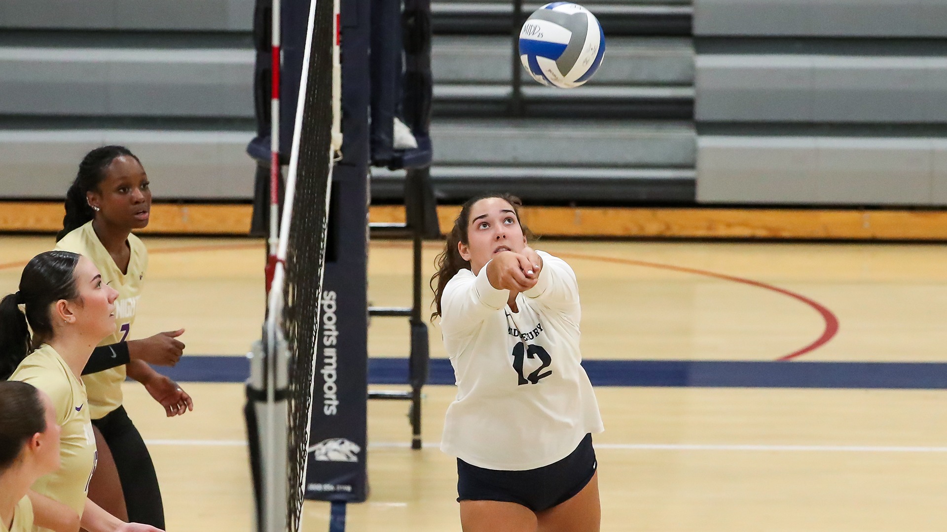 A photo of Middlebury volleyball player bumping a ball during a match against Saint Michael's in 2025.