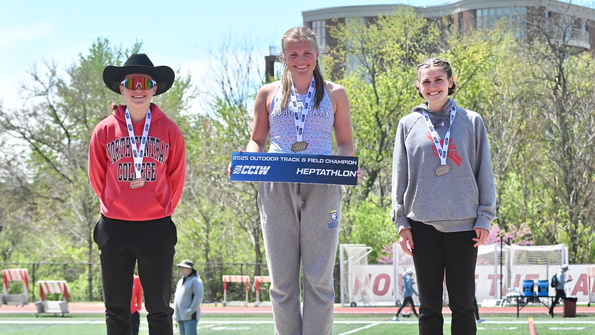 Ring poses with Heptathlon championship at CCIW Outdoor meet
