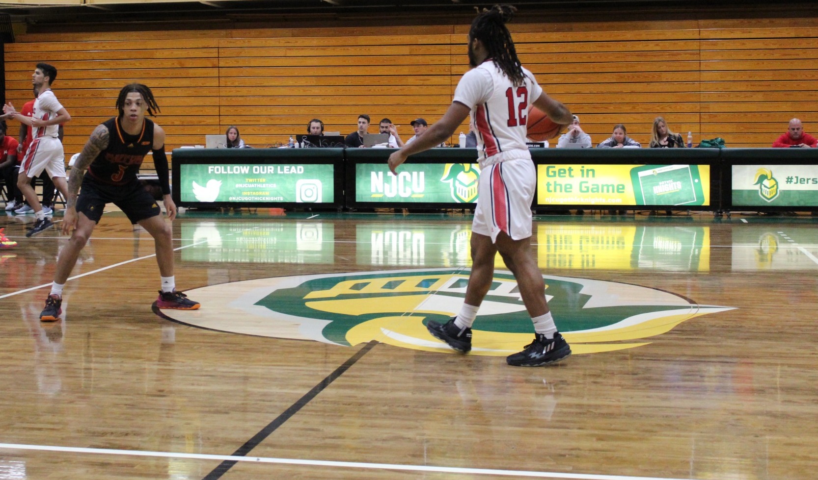 Isiah brings ball down the court