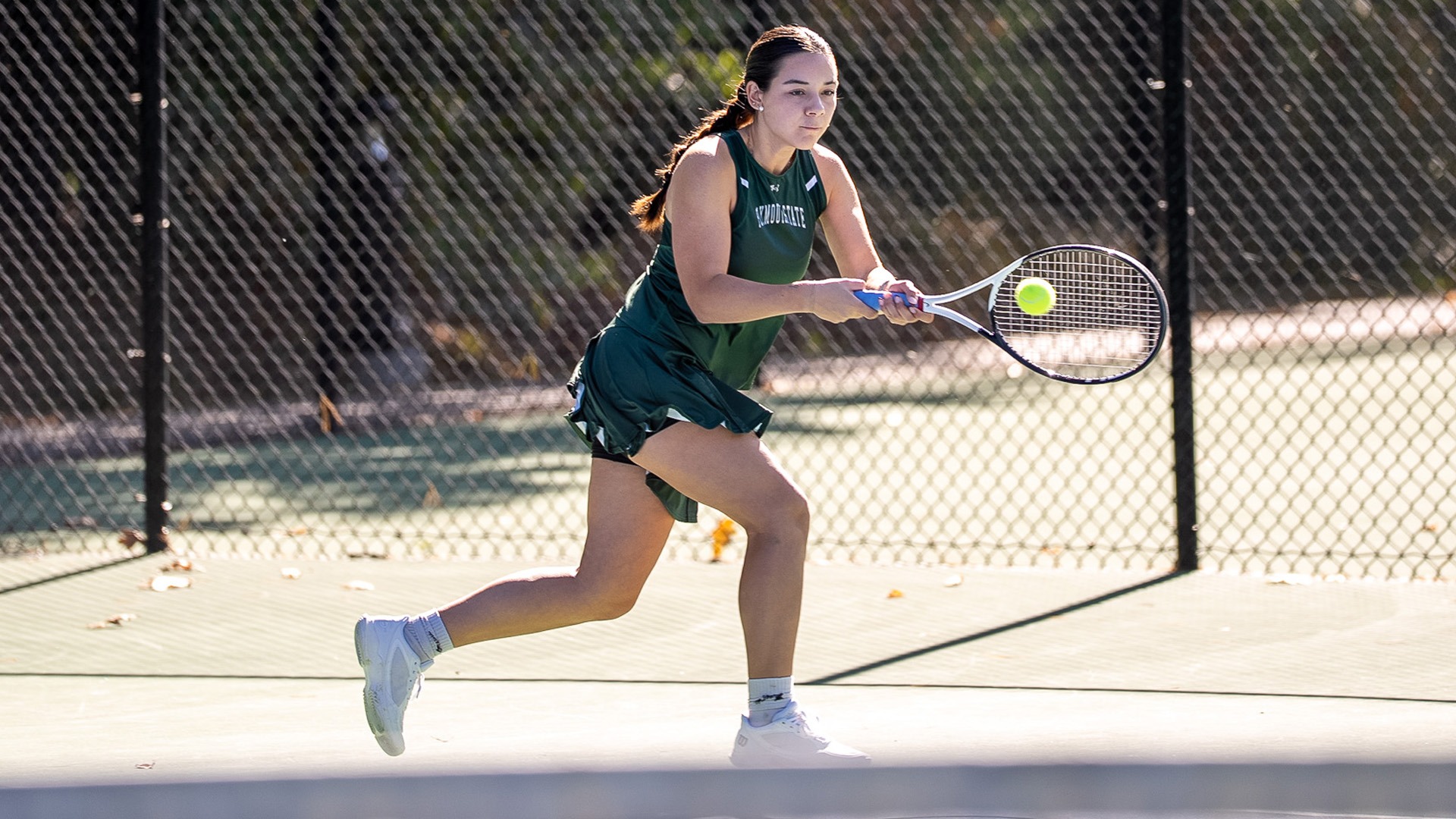 Lauryn Corrigan hits a backhand against WestConn