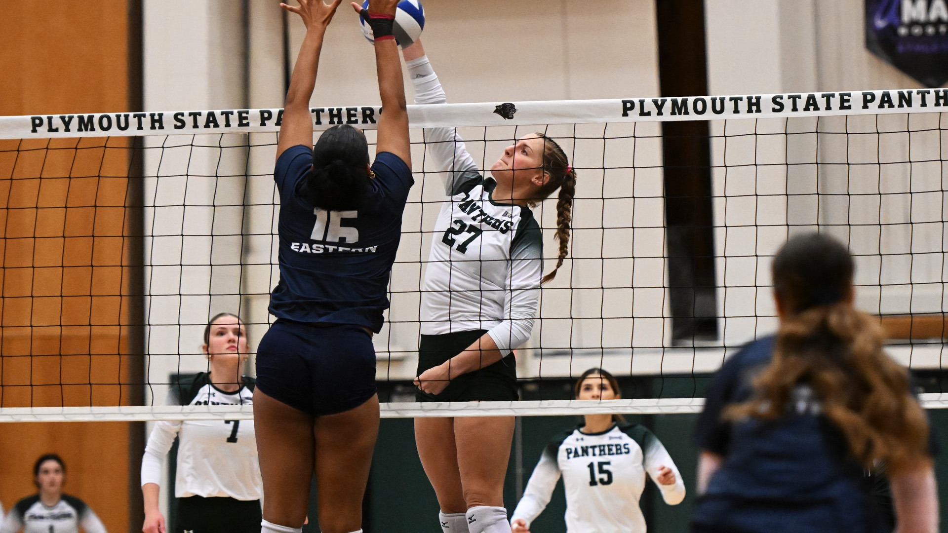 Sya McKay goes for a kill against Eastern Connecticut
