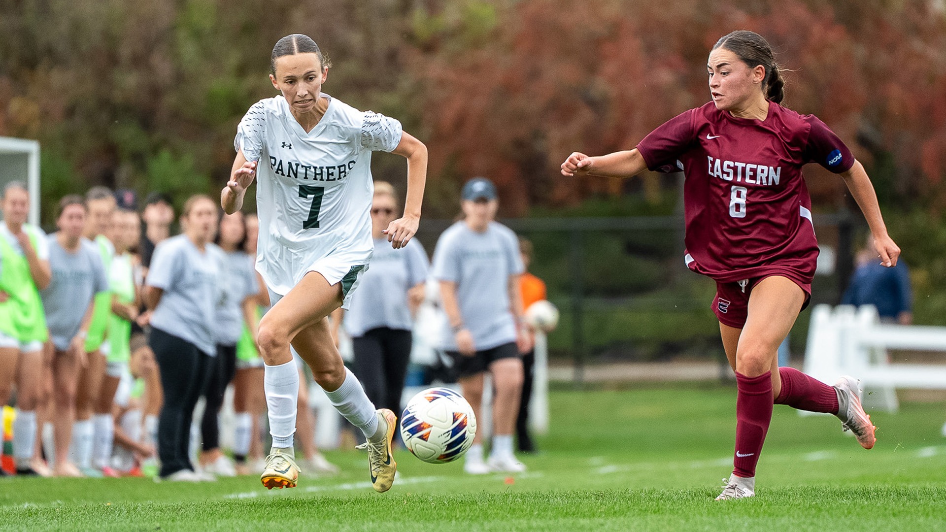Sophie West races an Eastern Connecticut player for a loose ball.