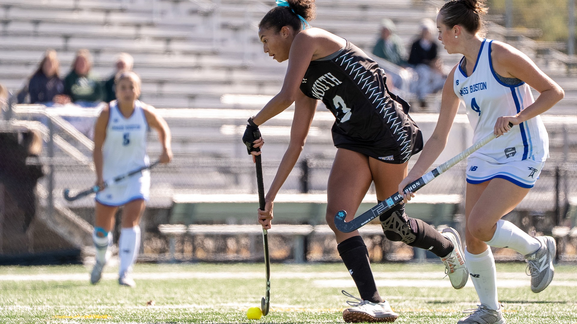 Jasmine Peterson dribbles past a UMass Boston player in recent action