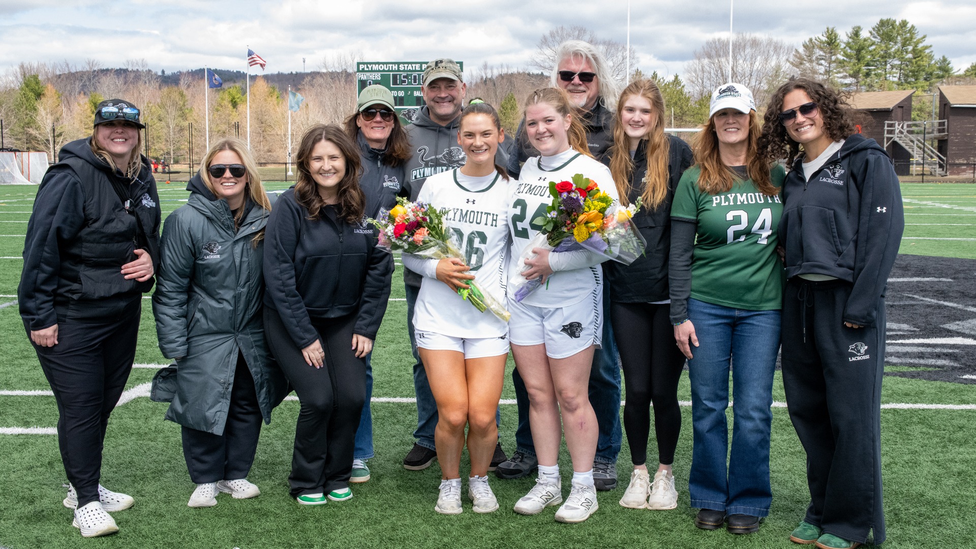 Women's Lacrosse seniors, coaches and families during Senior Day ceremony