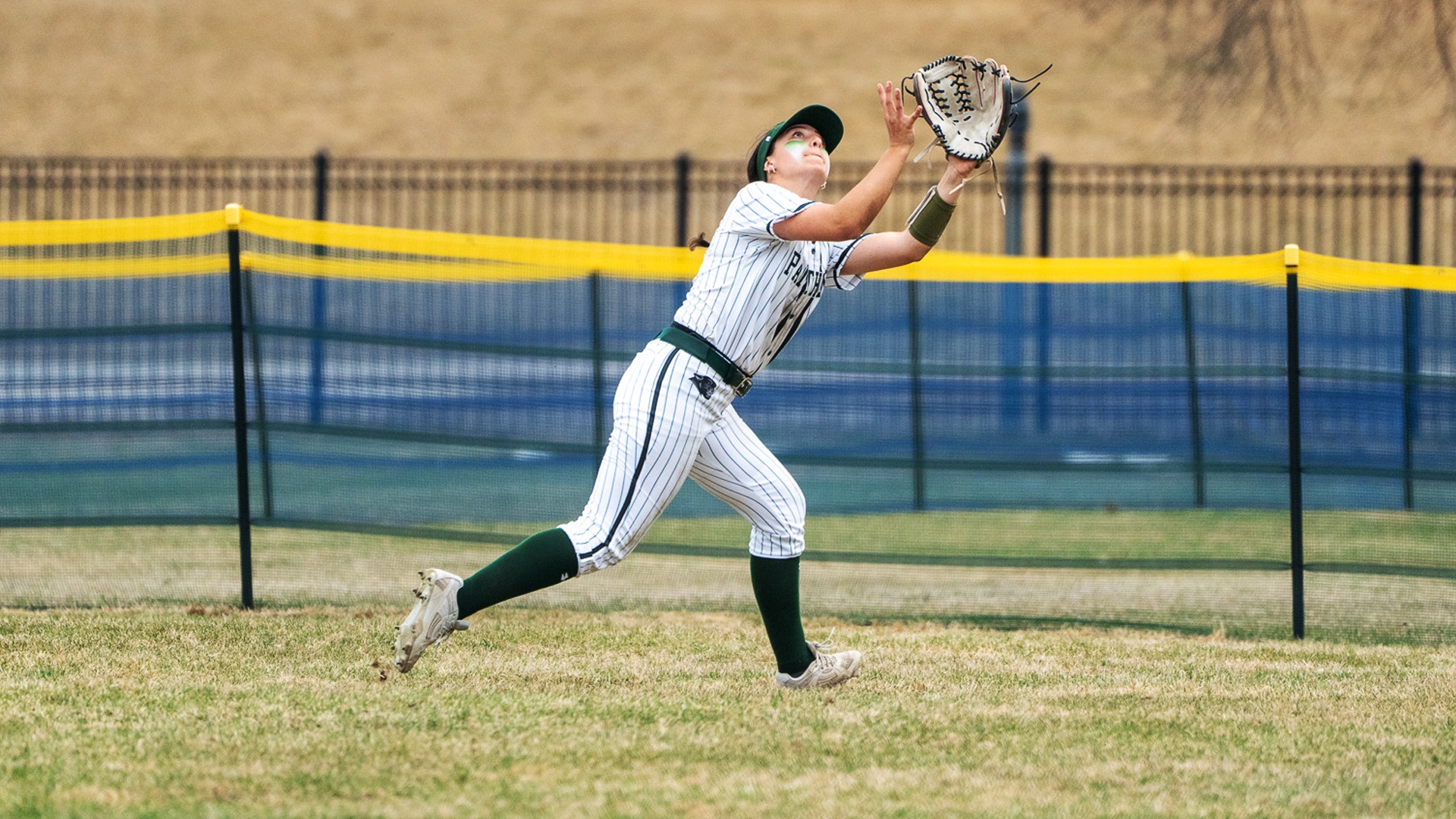 Marisa Lizotte makes a running catch against Castleton