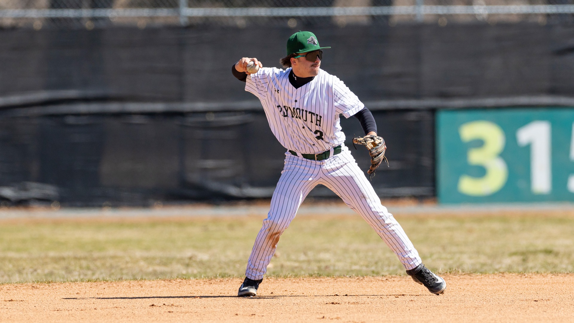 Owen Webber makes a throw from second base