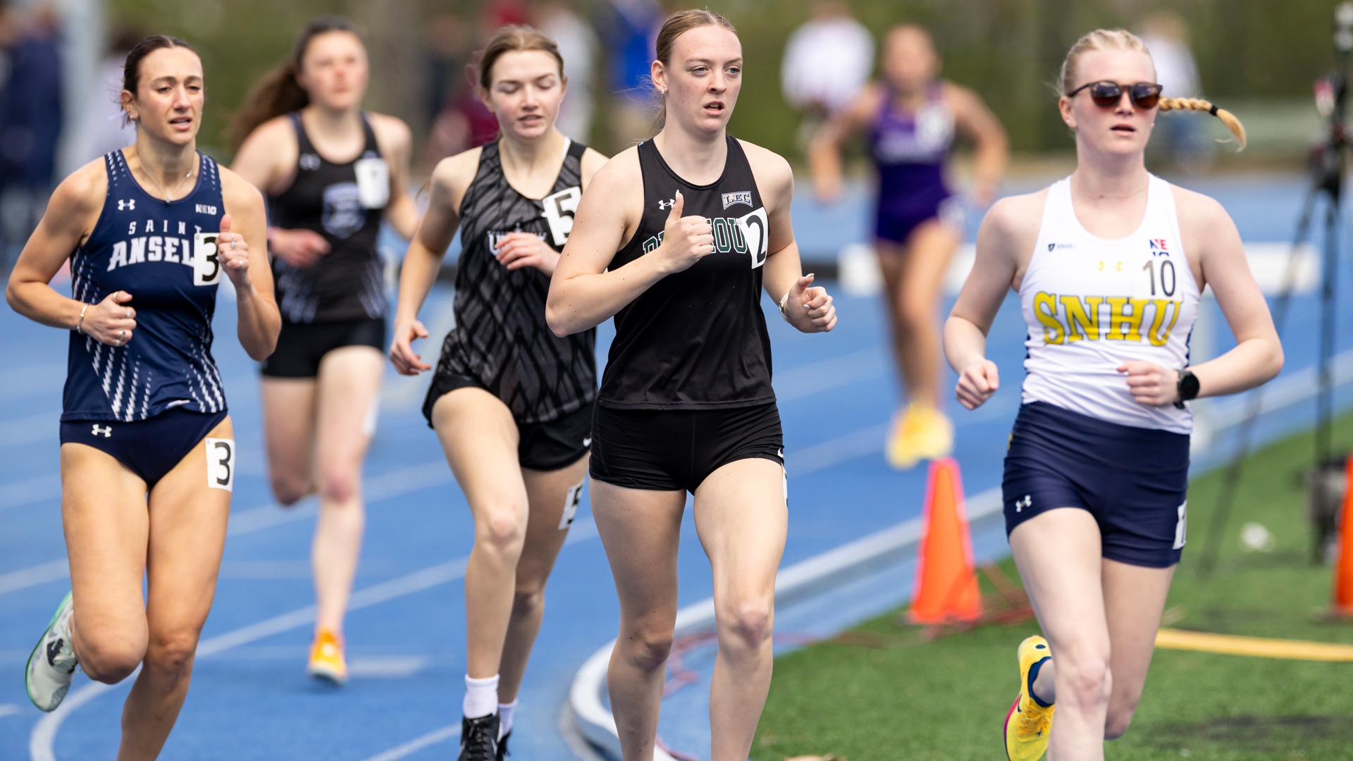 Mia Sweeney runs in a tight field at SNHU