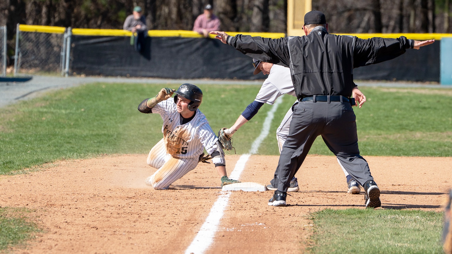Sam Salvi slides into third base with a triple against Southern Maine