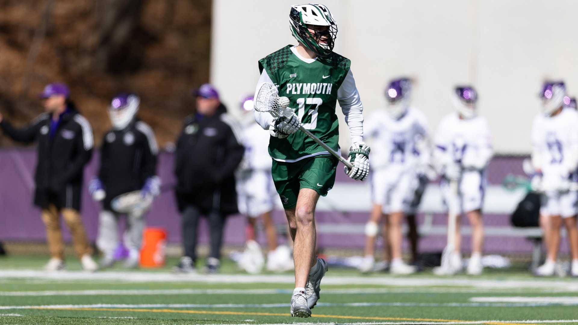 Blake McPherson cradles the ball in a game at Curry
