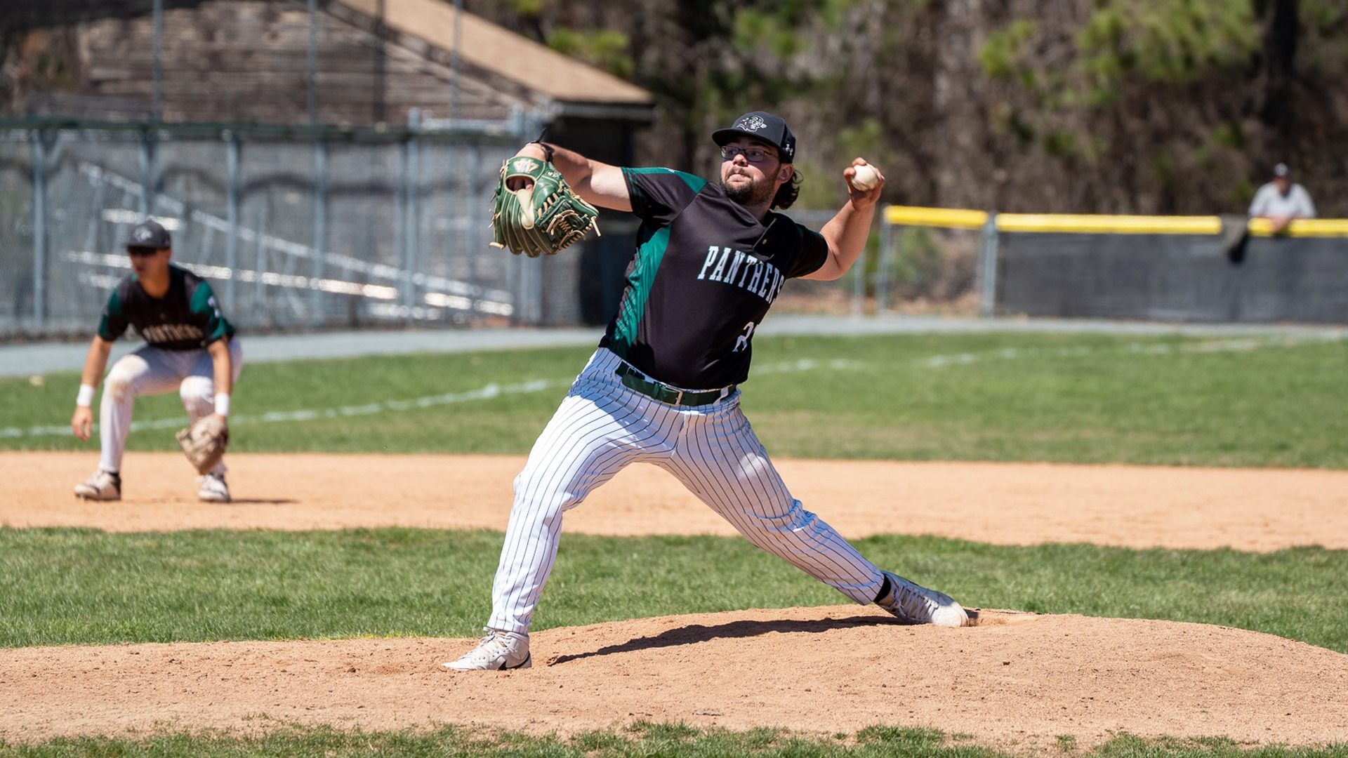 Aaron Kent delivers a pitch against New England College