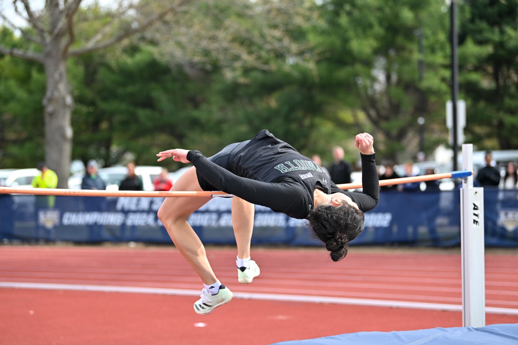 Amelia Lefebvre clears the high jump bar at the LEC Championship
