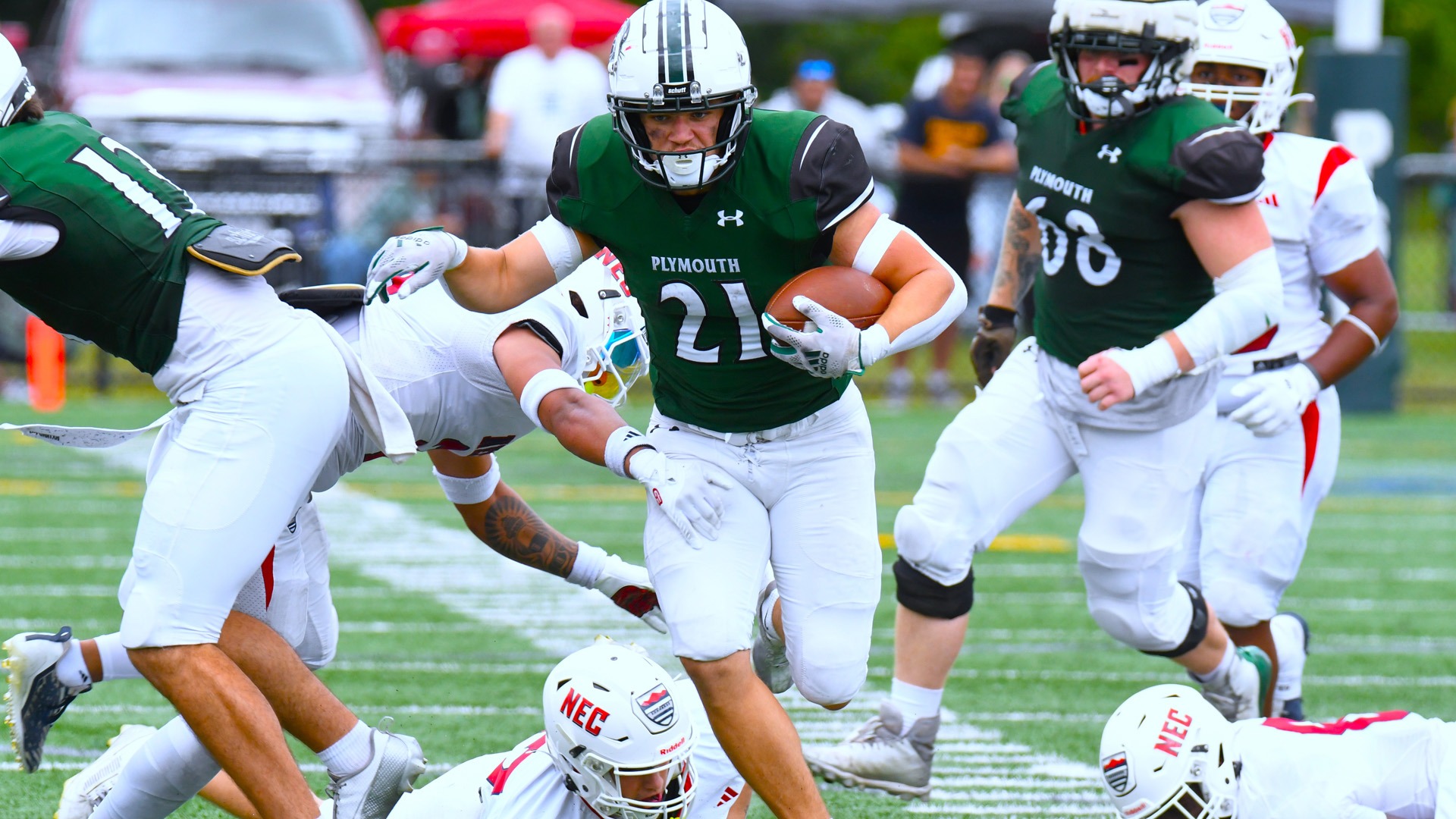 Reece Davis busts through the line against New England College