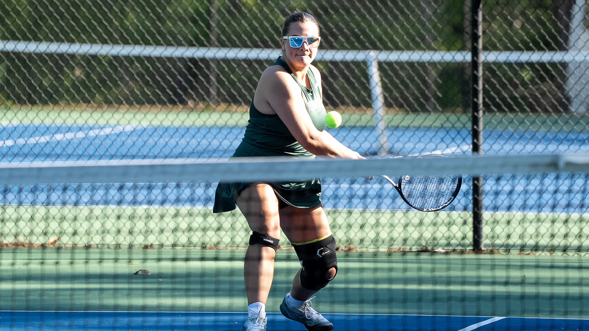 Sofia Orama hits a backhand against Plattsburgh State
