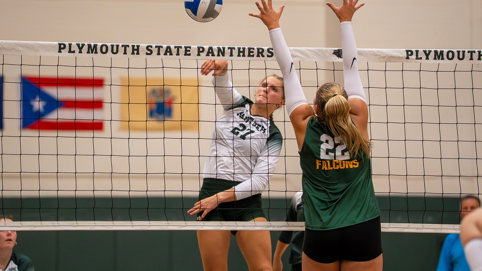 Sya McKay goes up for an attack against Fitchburg State