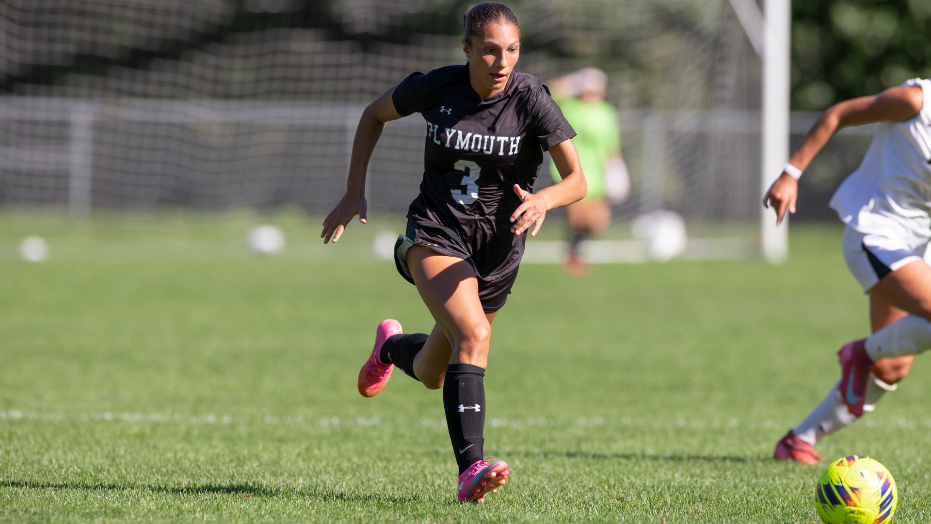 Bella Coporale dribbles past a Nichols defender in recent action