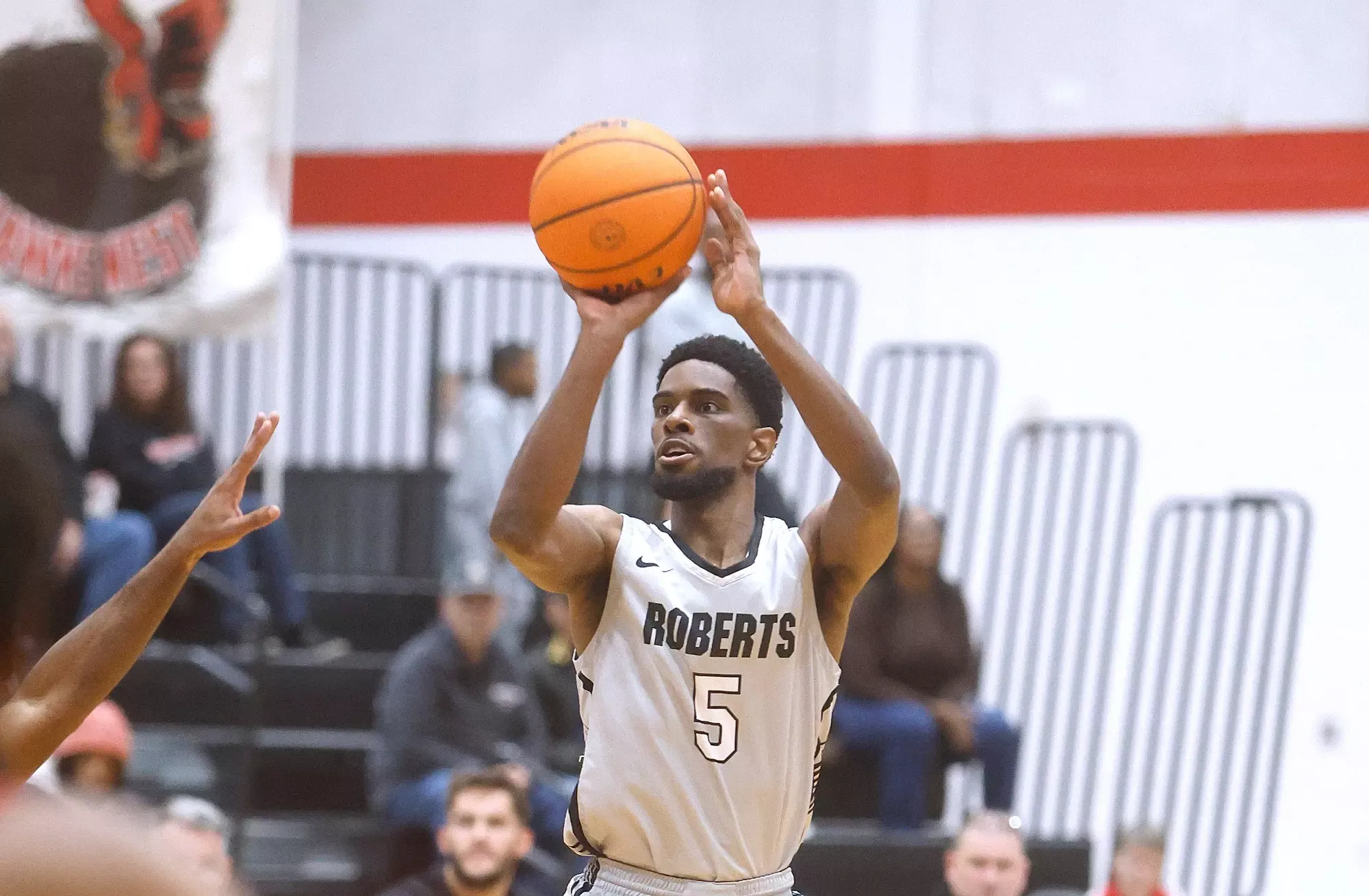 Collin Woods takes a jump shot against Mansfield 