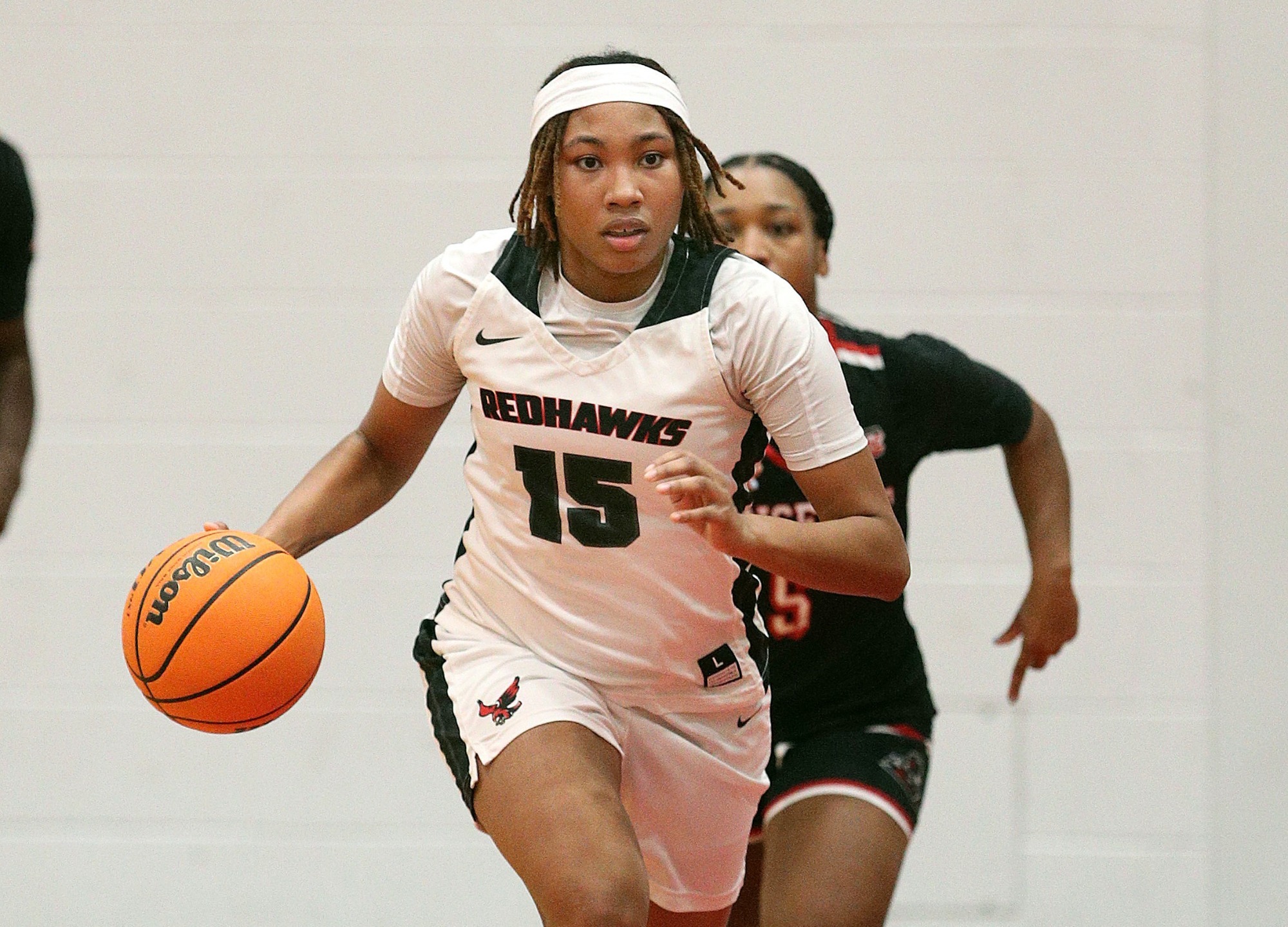 Erin Frazier dribbles the ball up the court in a game against Mansfield University. 