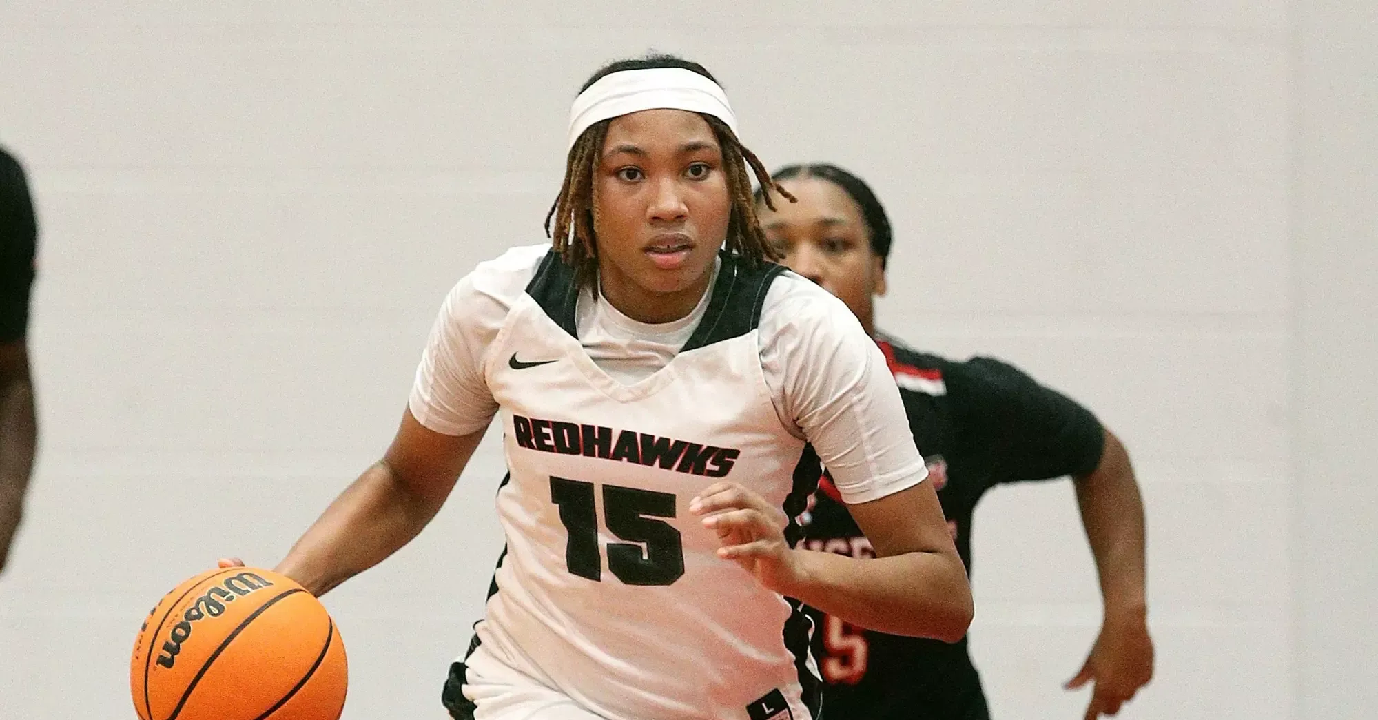 Erin Frazier dribbles the ball up the court in a game against Mansfield University. 