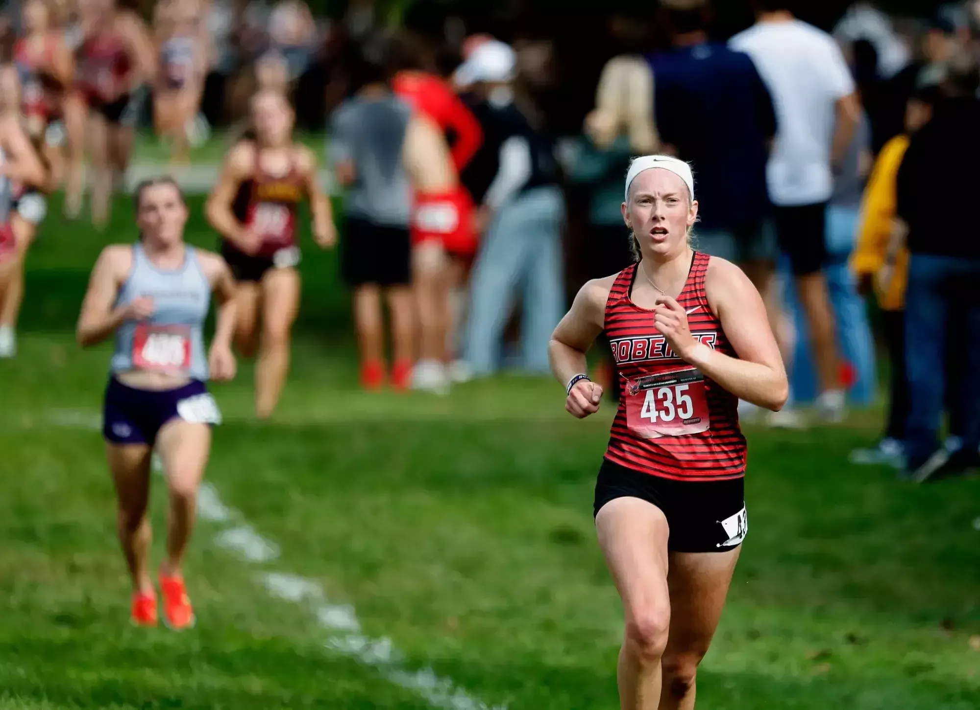 Evelyn Schmit runs toward the finish line at the Harry F. Anderson Invitational on Sept. 26, 2026. 