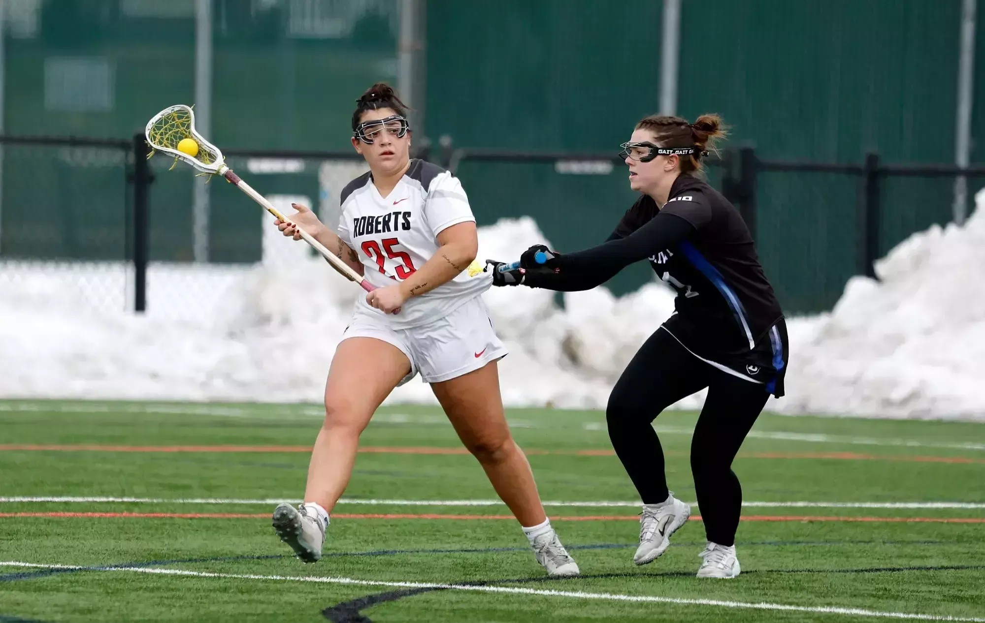 Ella Dossier looks to make a pass in a game against Bentley earlier this year. 