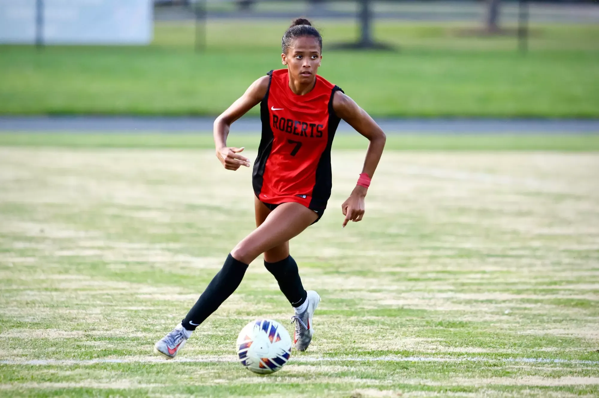 Ileana Cheruiyot dribbles upfield against Thomas More University.