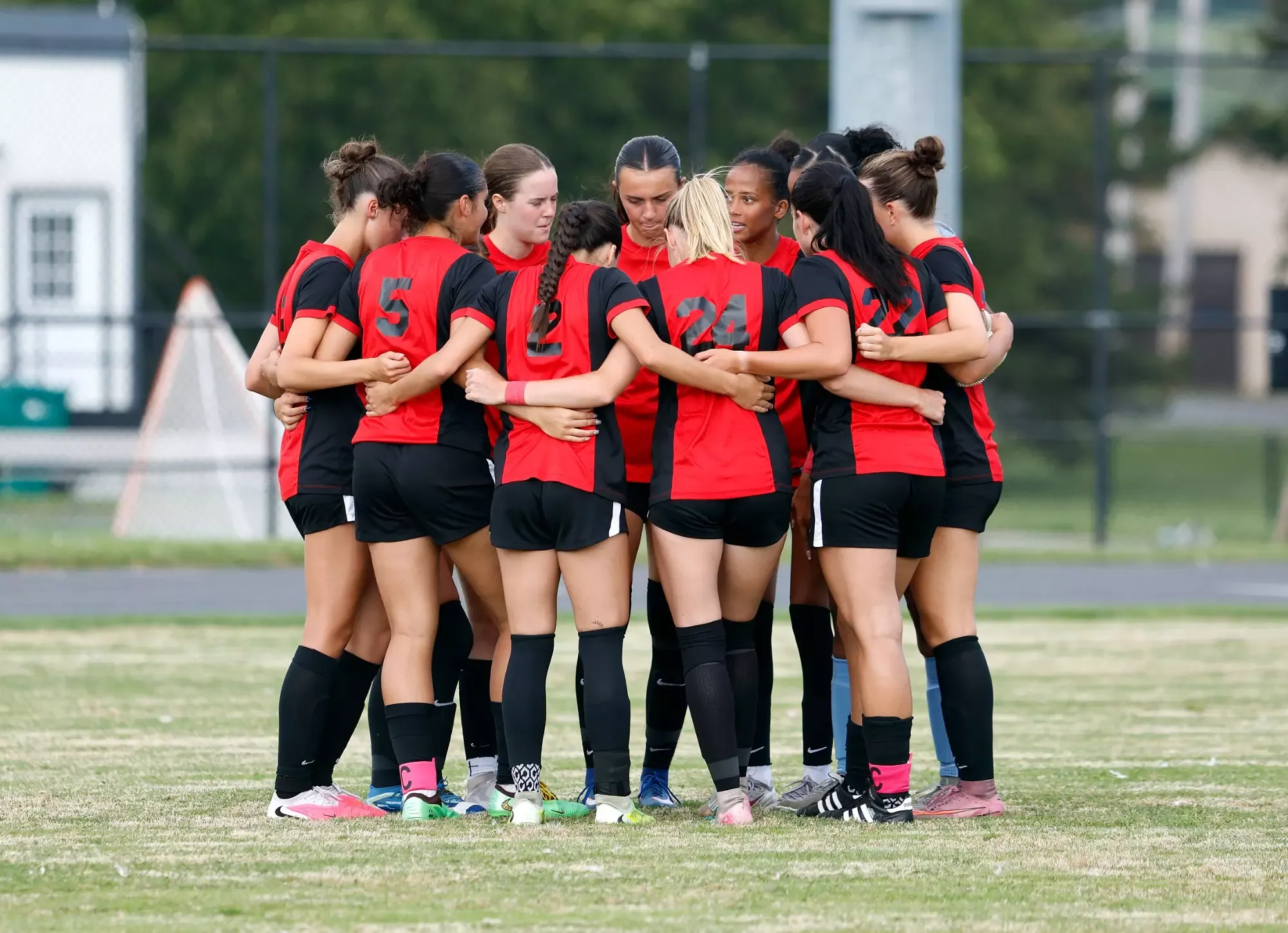 Members of the Roberts Wesleyan University women's soccer team huddle prior to a game against Thomas More University on Aug. 27, 2026. 