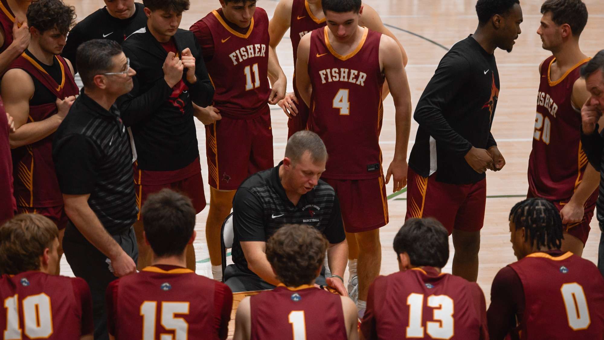 Mike Grosodonia draws up a play in the huddle agaisnt Russell Sage, E8 semifinals