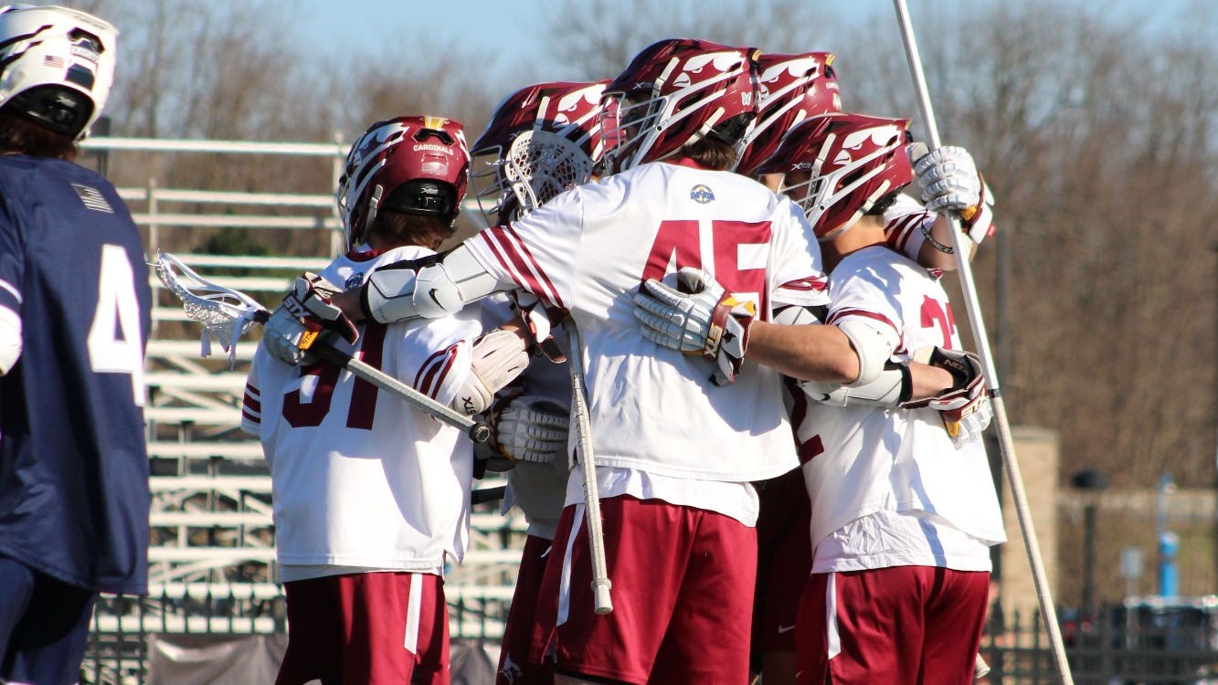 MLAX Celebrates a goal against Geneseo on April 8