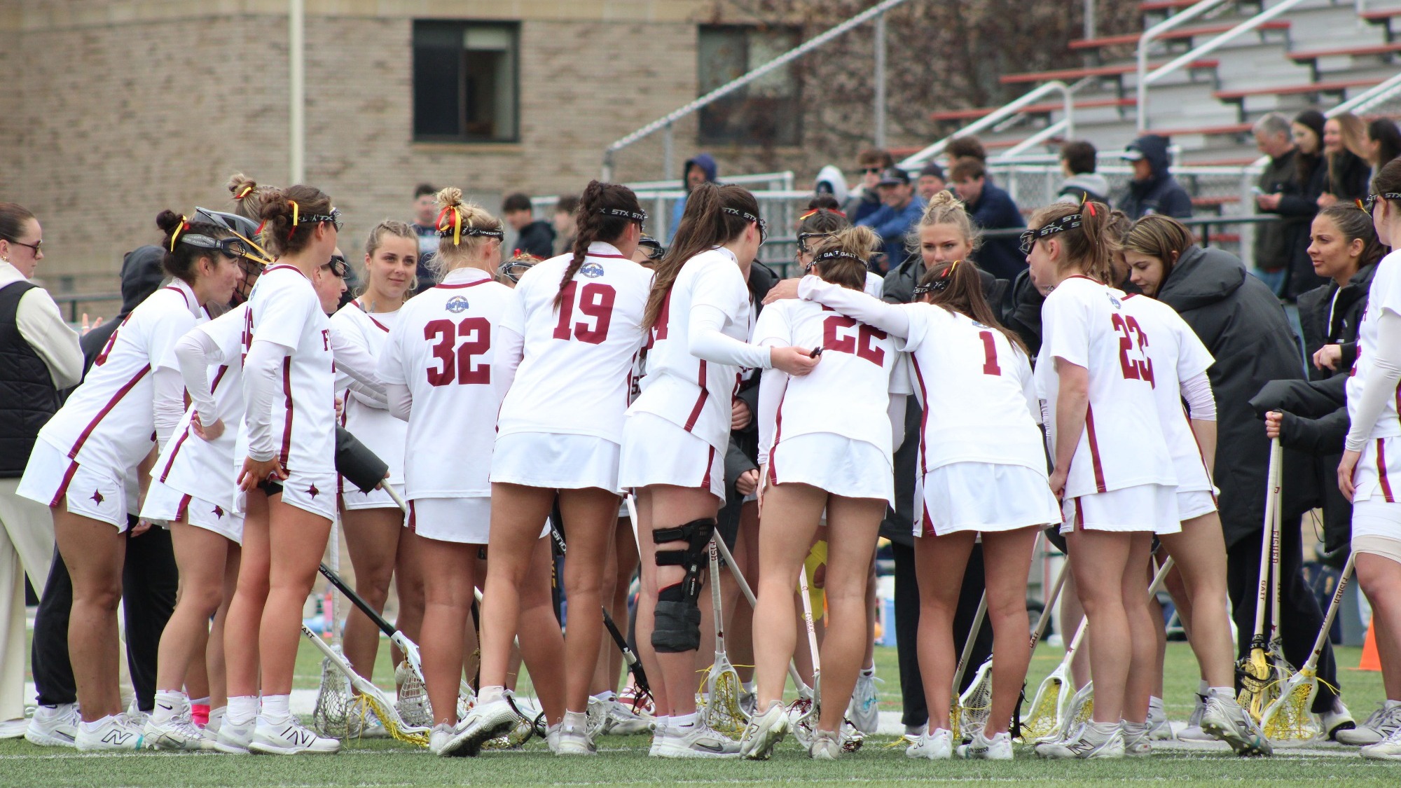 WLAX Team Shot In Huddle During Championship Game