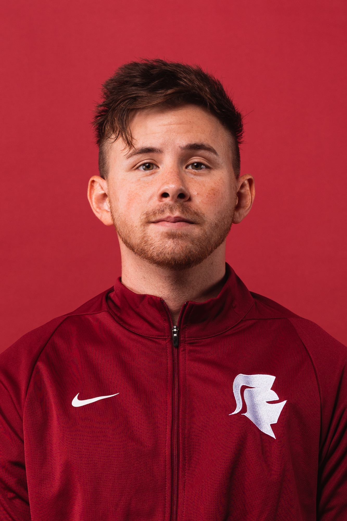 Members of the Cross Country team get their headshots taken for the upcoming 2023-2024 season in the Photo Studio in Main Hall at Southern Virginia University in Buena Vista, Virginia on August 17, 2023 (Caleb Palmer, Marketing)