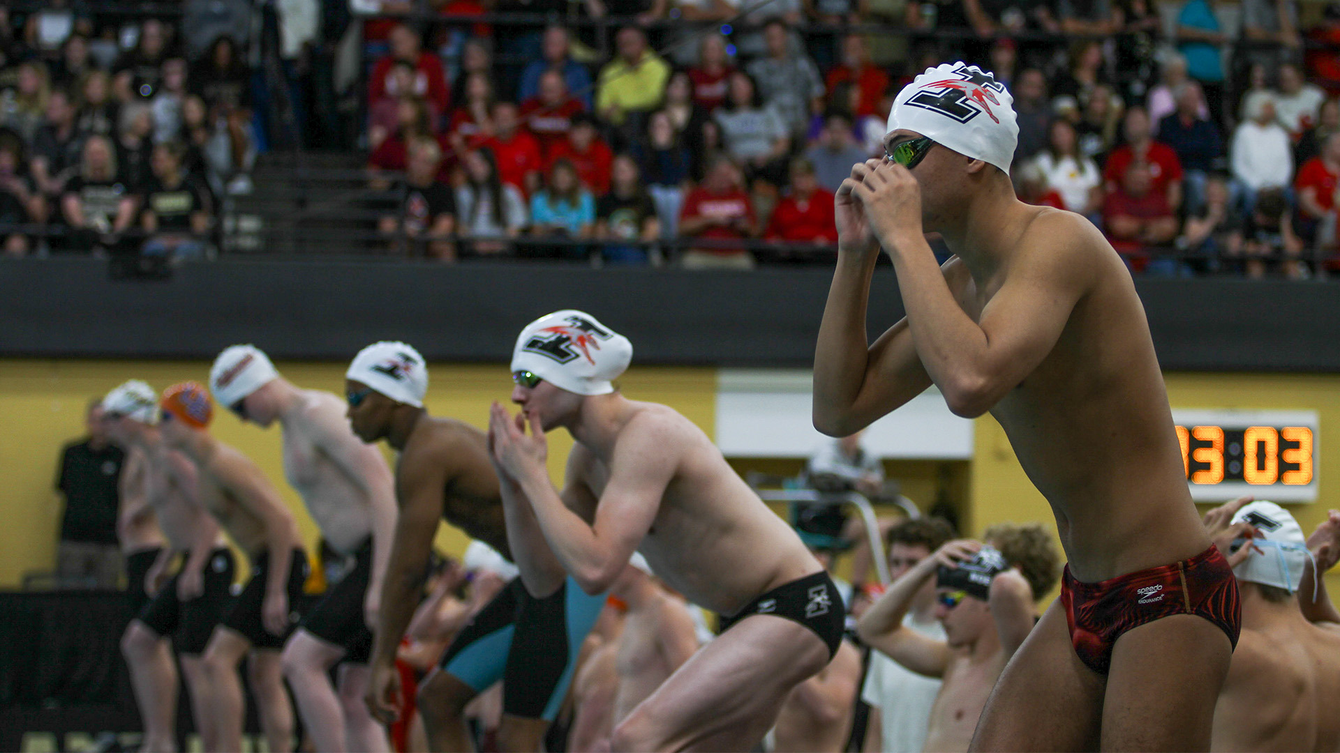 UIndy swimmers on the starting block.