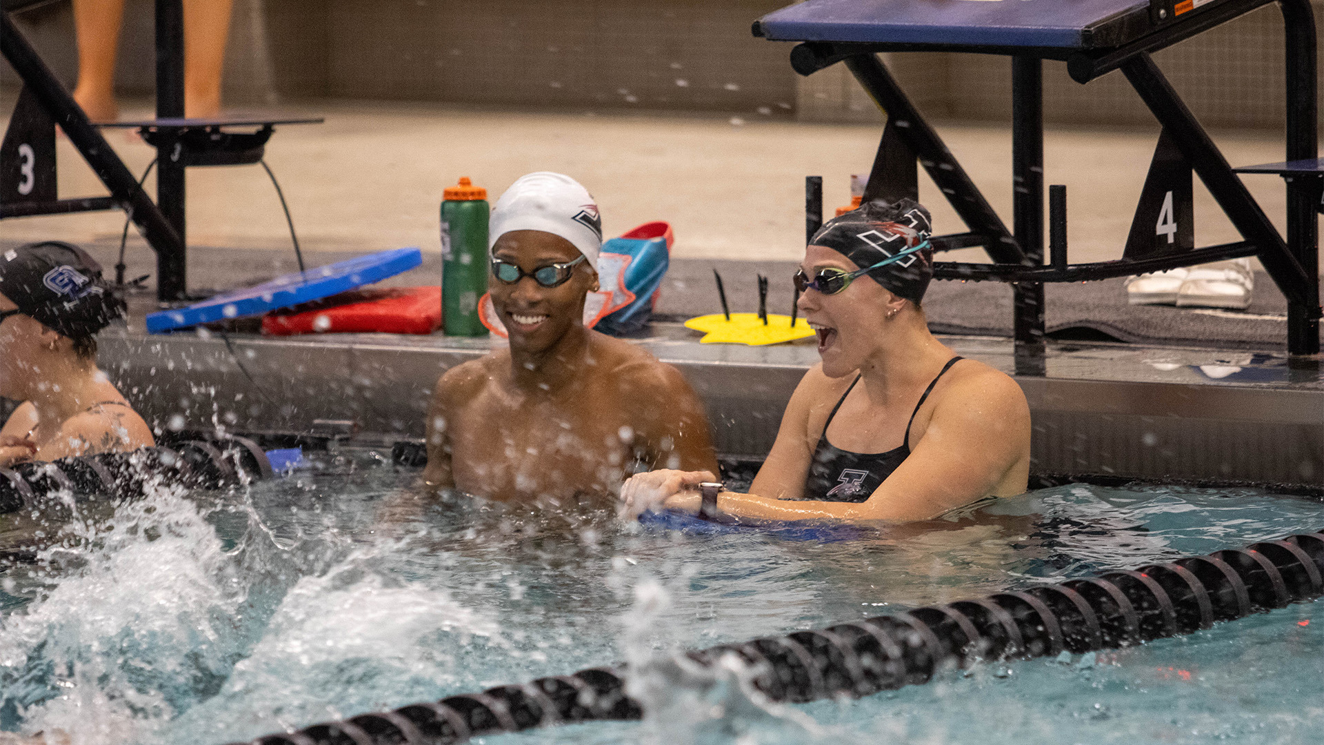 Members of the UIndy swimmingand diving team warming up.